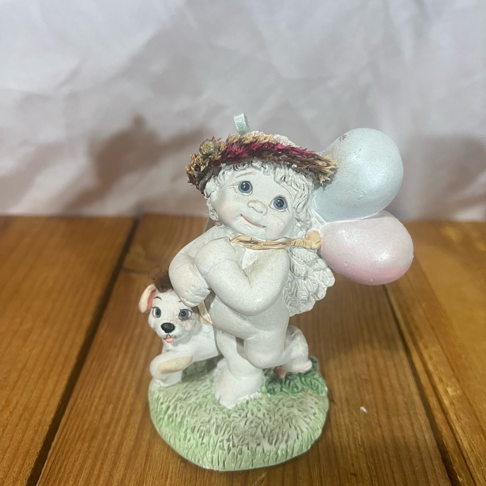 Whimsical Cherub Figurine with Pastel Balloons